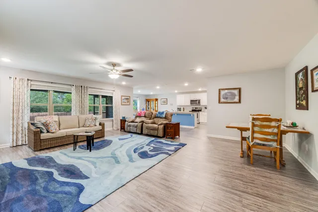 a living room with furniture and a table
