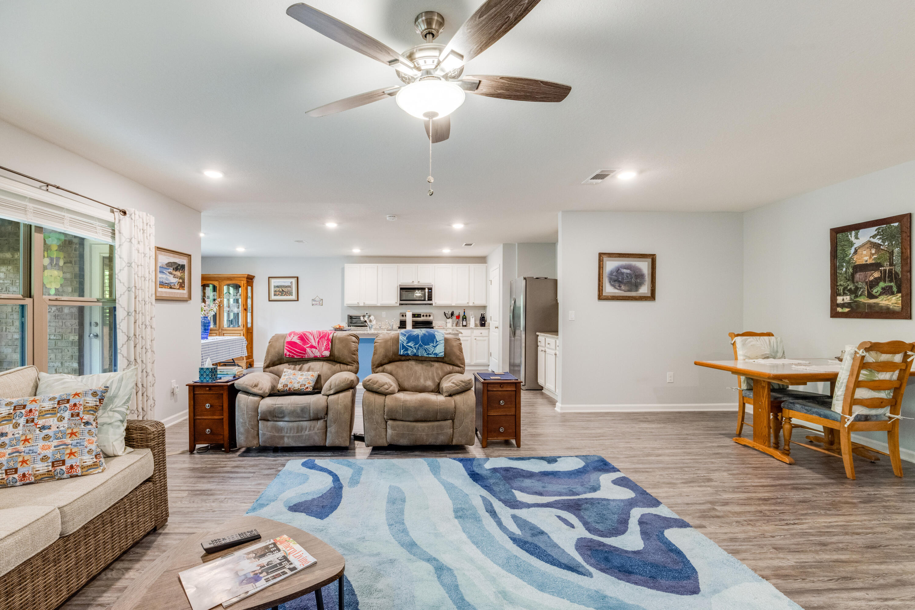340 Merlin Court Crestview, FL 32539 - Photo 10 of 63 a living room with furniture and a wooden floor