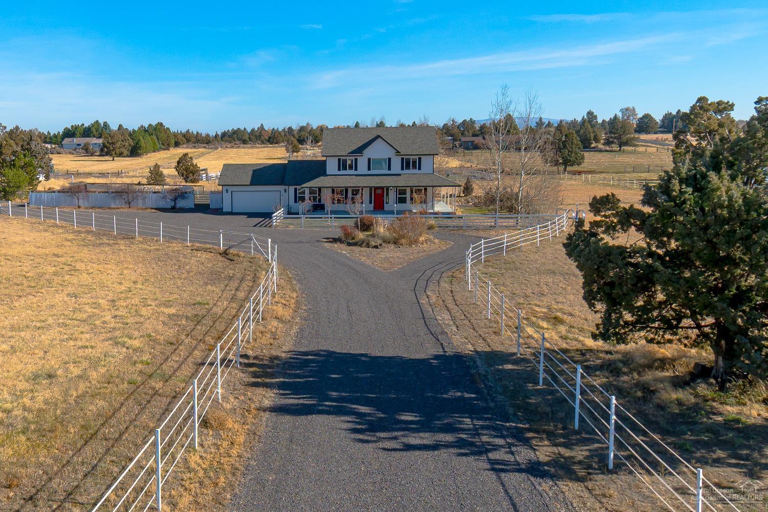 61490 Ward Road Bend, OR 97702 - Photo 2 of 25 a view of a lake with a building in the background
