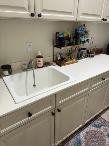a bathroom with a sink and cabinets