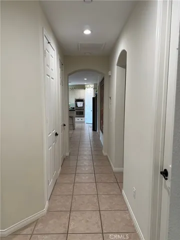 a view of a porch with furniture and a yard