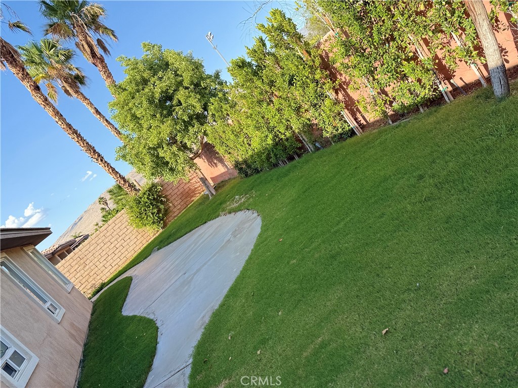 244 Via Padua Rancho Mirage, CA 92270 - Photo 28 of 35 a view of a yard with an outdoor space
