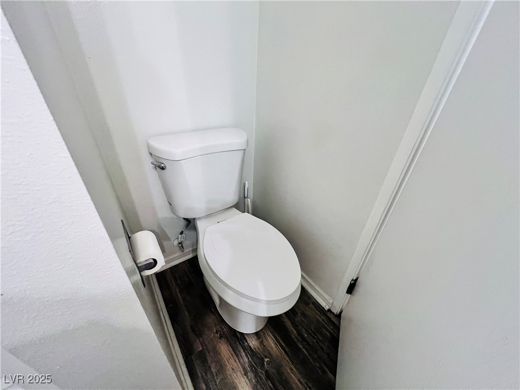 5048 Spencer Street, Unit C Las Vegas, NV 89119 - Photo 17 of 20 Bathroom with toilet and wood finished floors