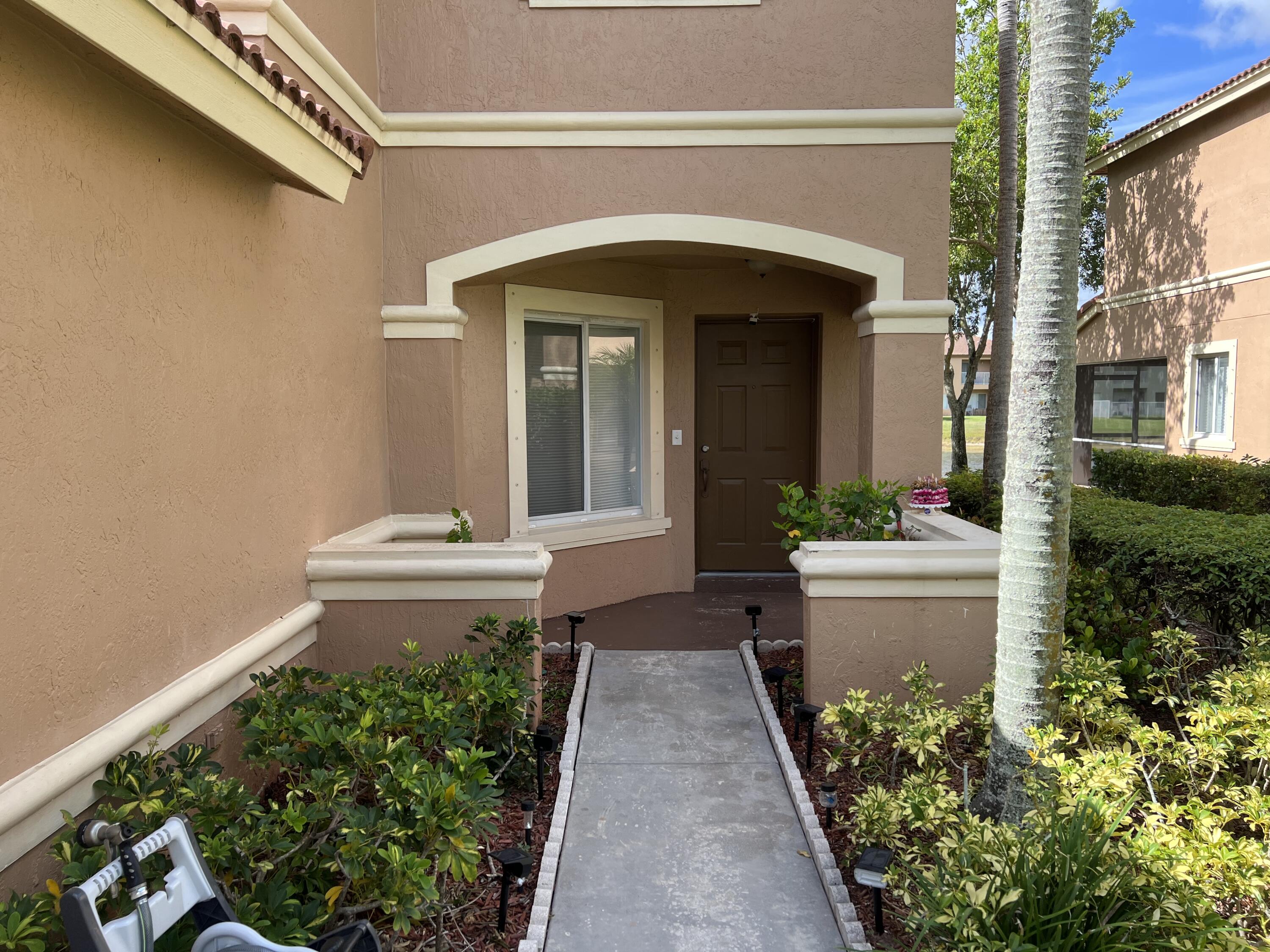 8012 Big Pine Way Riviera Beach, FL 33407 - Photo 3 of 19 Front