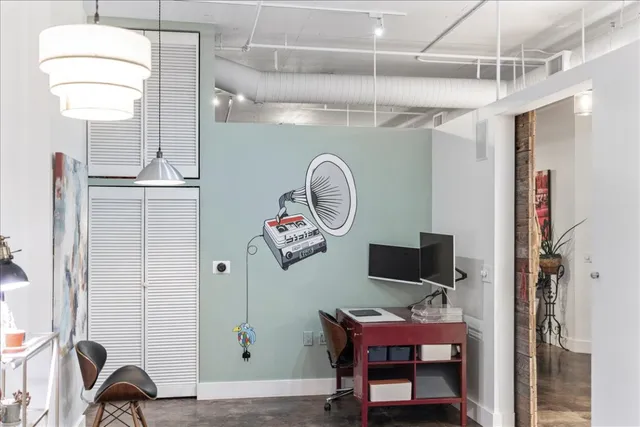 a view of a workspace with furniture