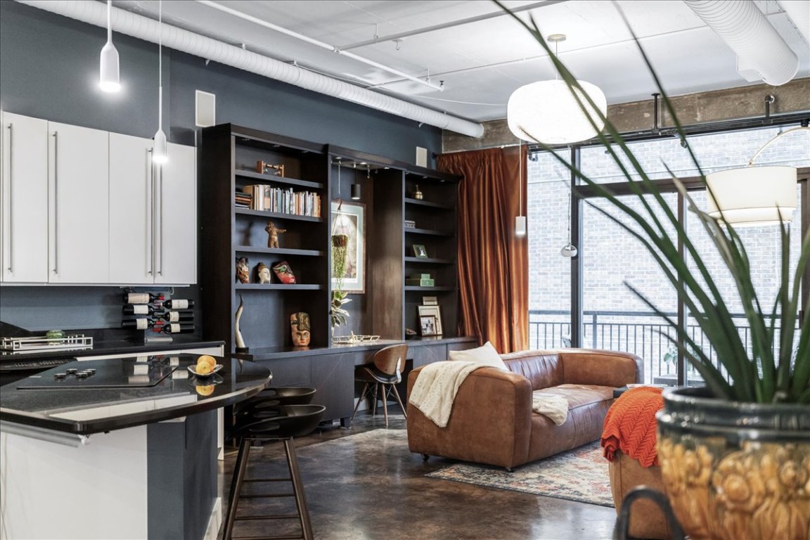311 West 5th Street, Unit 1008 Austin, TX 78701 - Photo 6 of 31 a living room with furniture and a potted plant