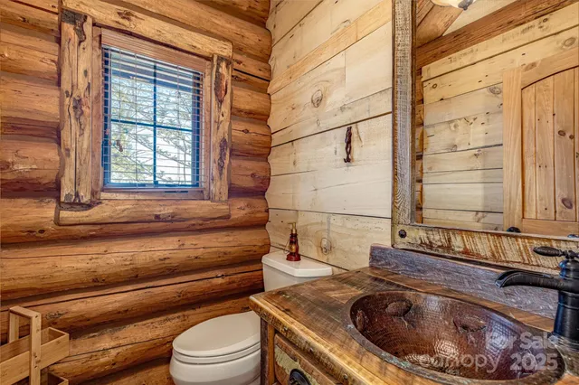 a spacious bedroom with a bed and a window