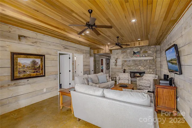 a bathroom with a glass door shower and a sink