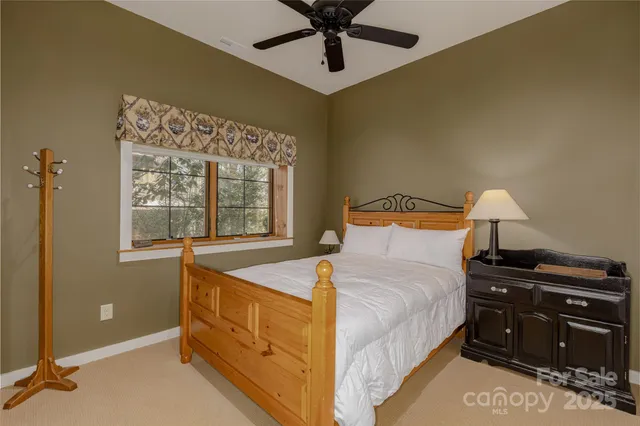 a living room with a large bed and a large window