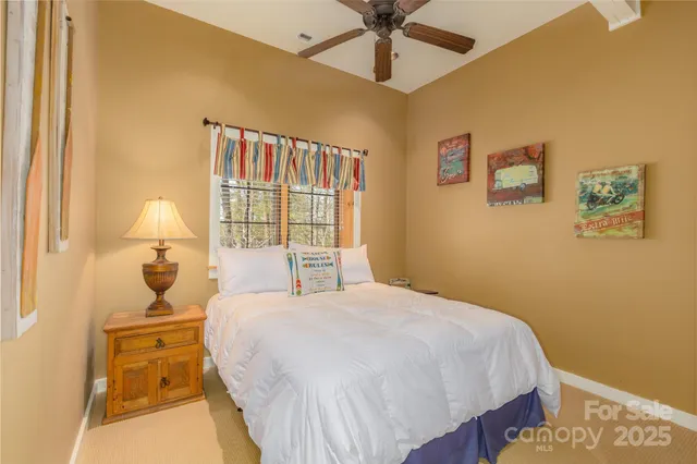 a yellow house with trees in front of it