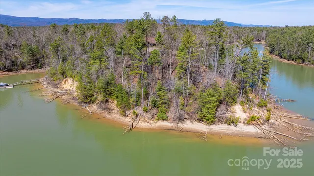 a view of a lake with outdoor seating space