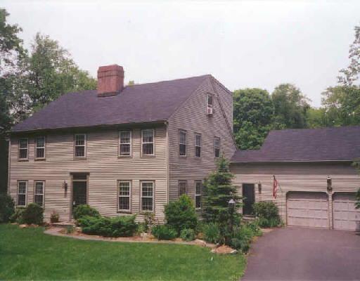 184 Ridgefield Road Wilton, CT 06897 - Photo 1 of 1 a front view of a house with a yard and a garage