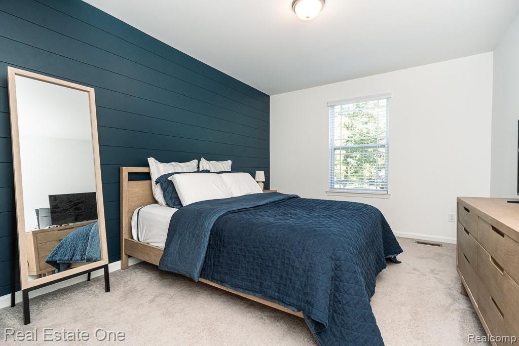 201 Beechview Drive Rochester, MI 48306 - Photo 31 of 49 Wall-to-wall carpeting, window with blinds, overhead flush mount light fixture, shiplap accent wall