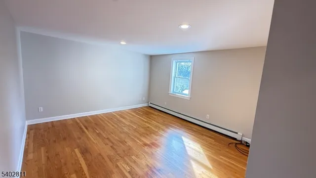a view of an empty room and a window