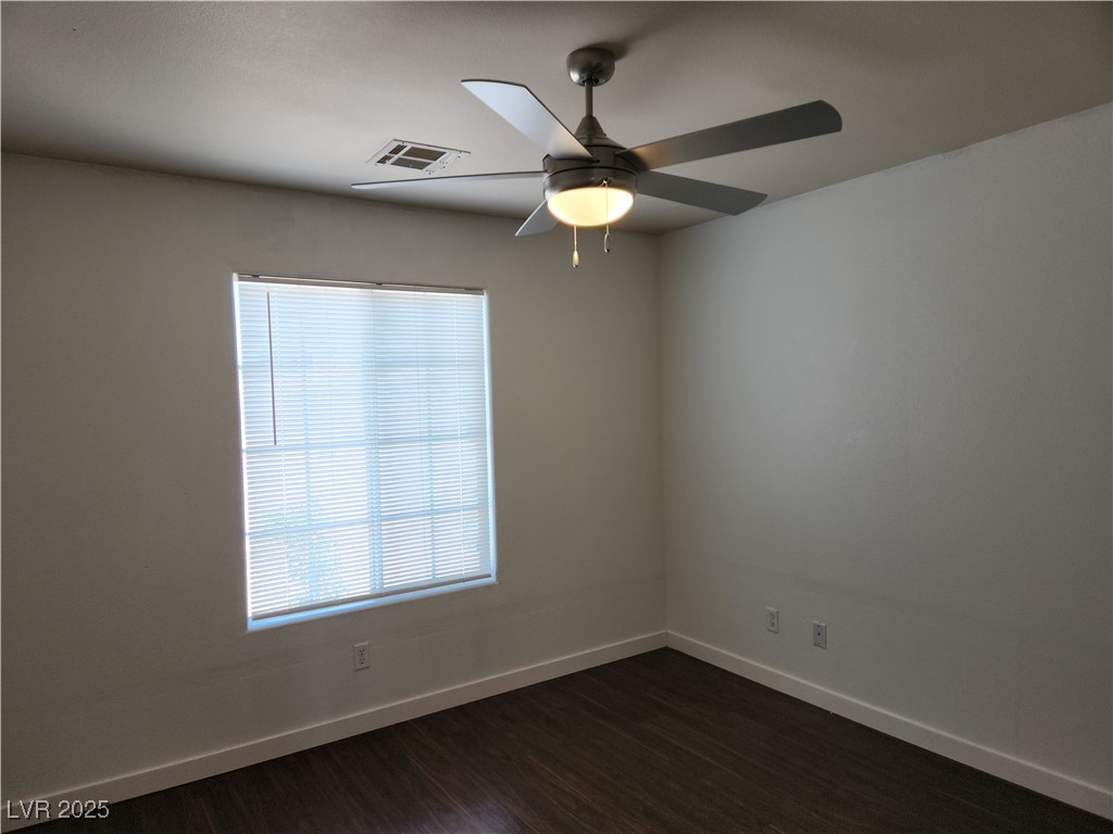 161 Diamond Bar Road Pahrump, NV 89048 - Photo 13 of 29 Bedroom #2 featuring plenty of natural light, dark wood-type flooring, and a ceiling fan