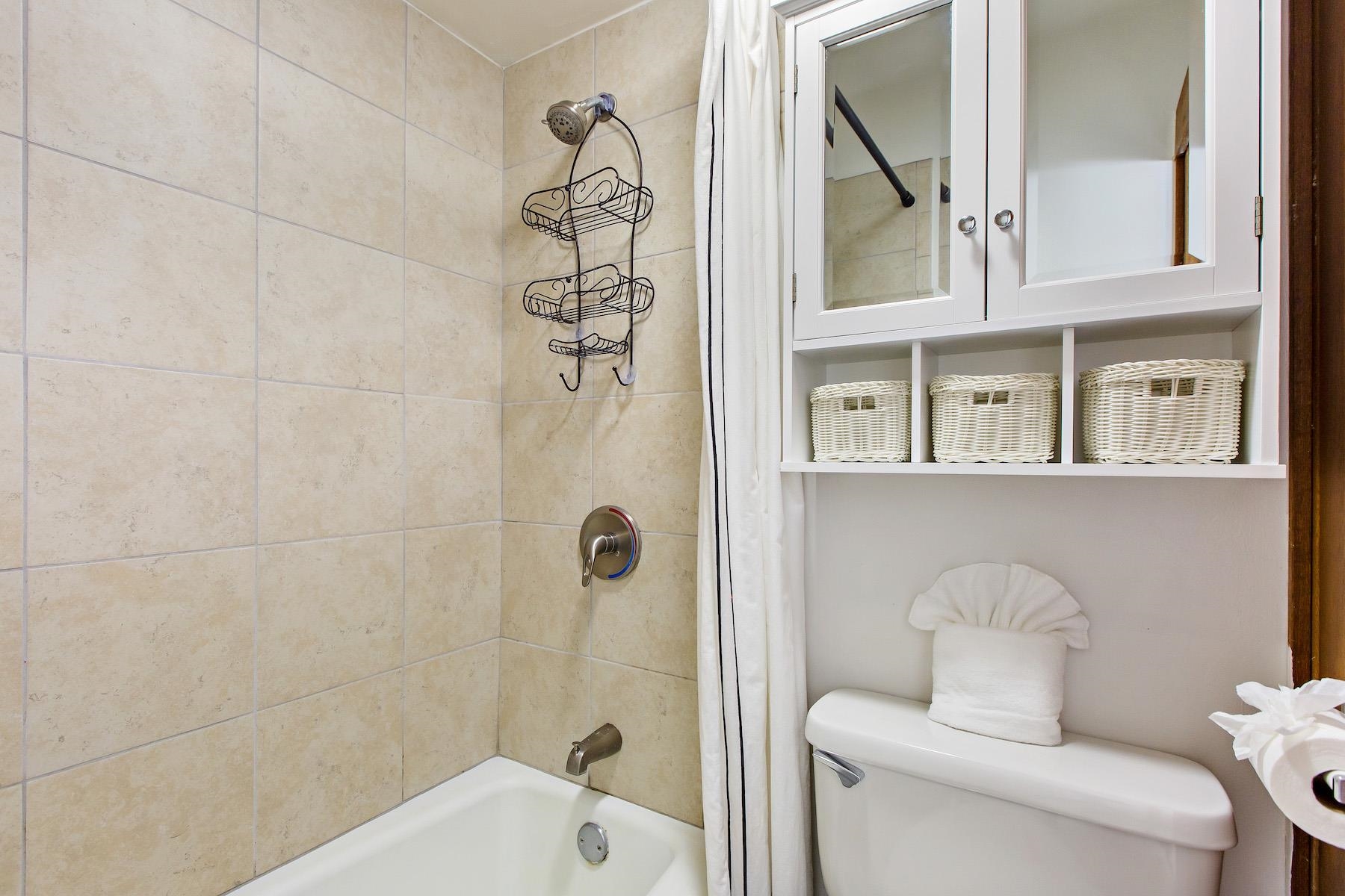 4310 Lower Honoapiilani Road, Unit 218 Lahaina, HI 96761 - Photo 16 of 30 a bathroom with a toilet sink and shower