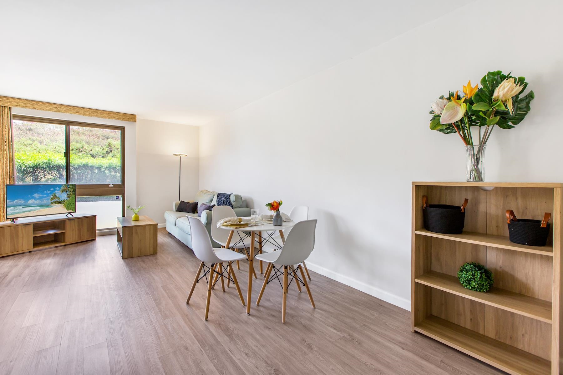 4310 Lower Honoapiilani Road, Unit 218 Lahaina, HI 96761 - Photo 2 of 30 a living room with furniture and a potted plant