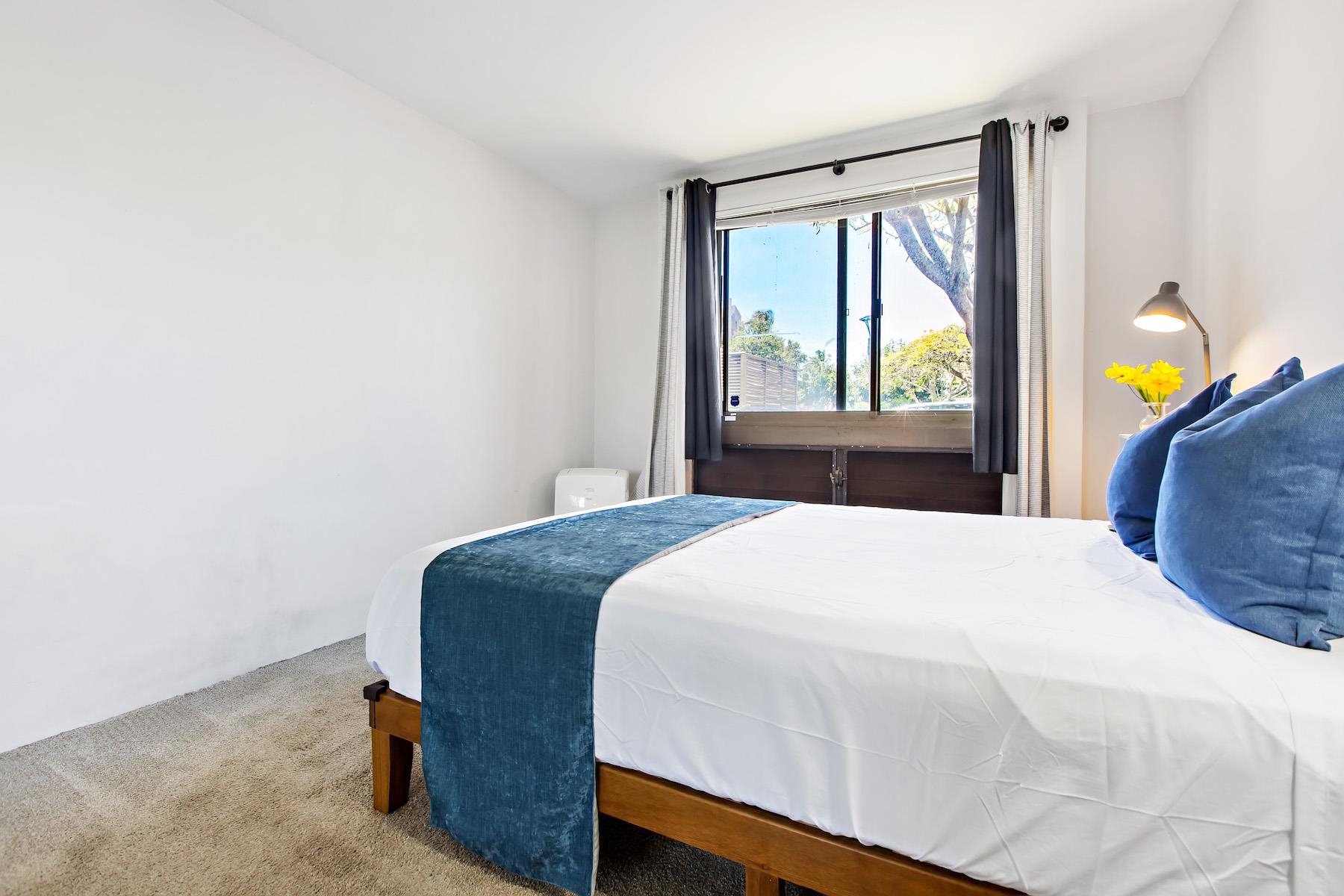 4310 Lower Honoapiilani Road, Unit 218 Lahaina, HI 96761 - Photo 22 of 30 a bedroom with a bed and window