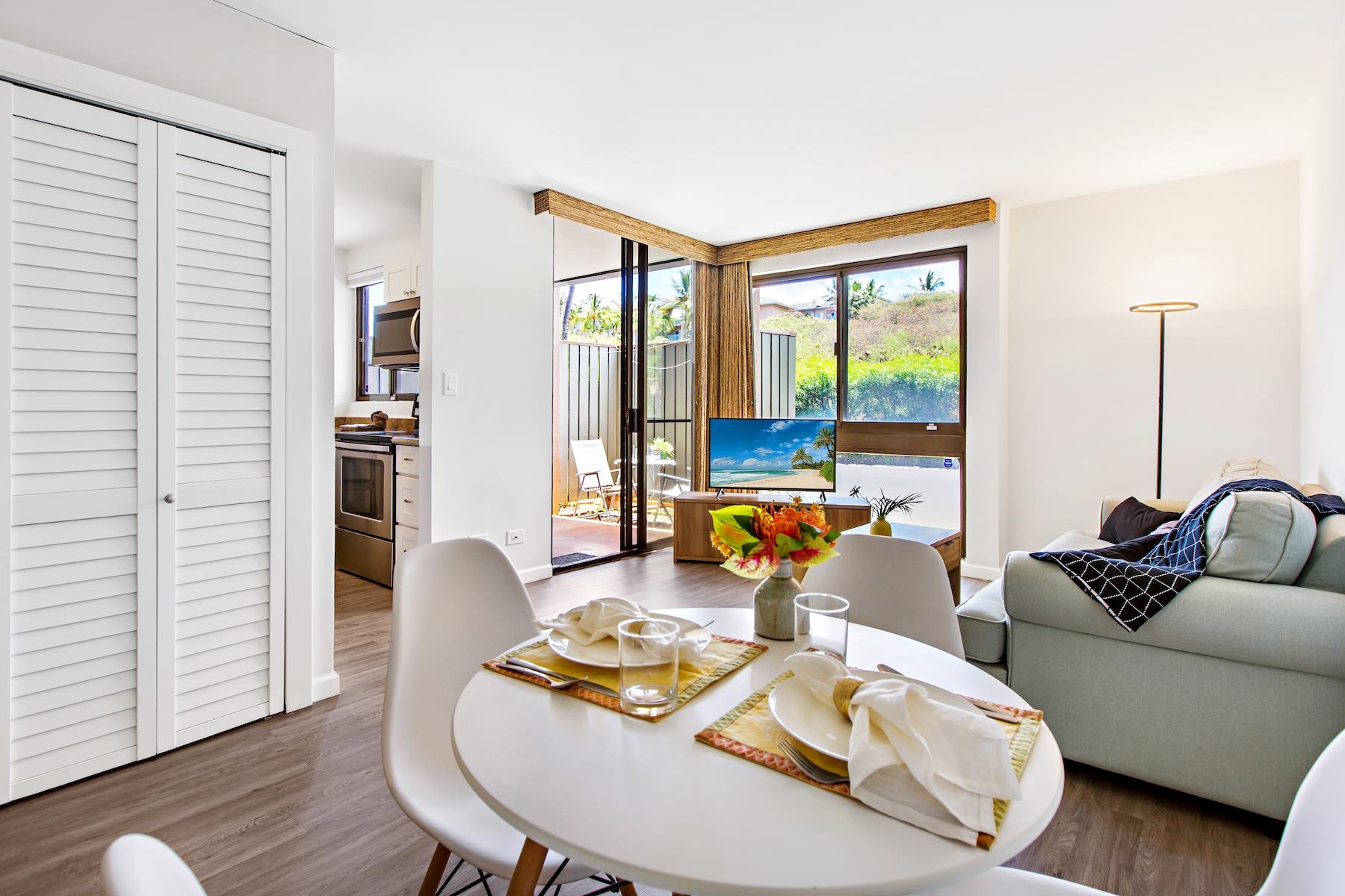 4310 Lower Honoapiilani Road, Unit 218 Lahaina, HI 96761 - Photo 3 of 30 a living room with furniture and a large window