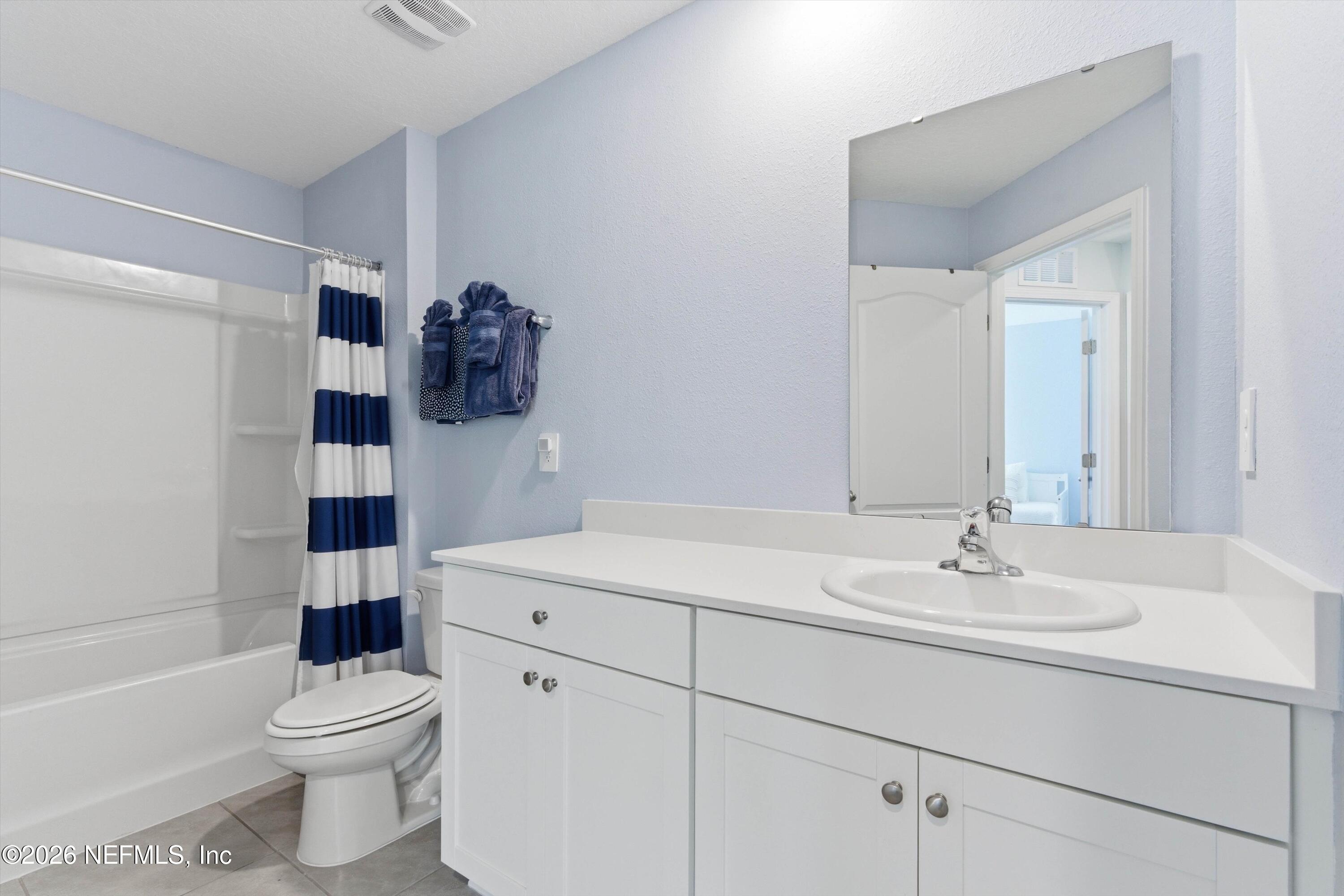 103 Seaport Breeze Road St. Augustine, FL 32095 - Photo 24 of 44 a bathroom with a sink a toilet and shower