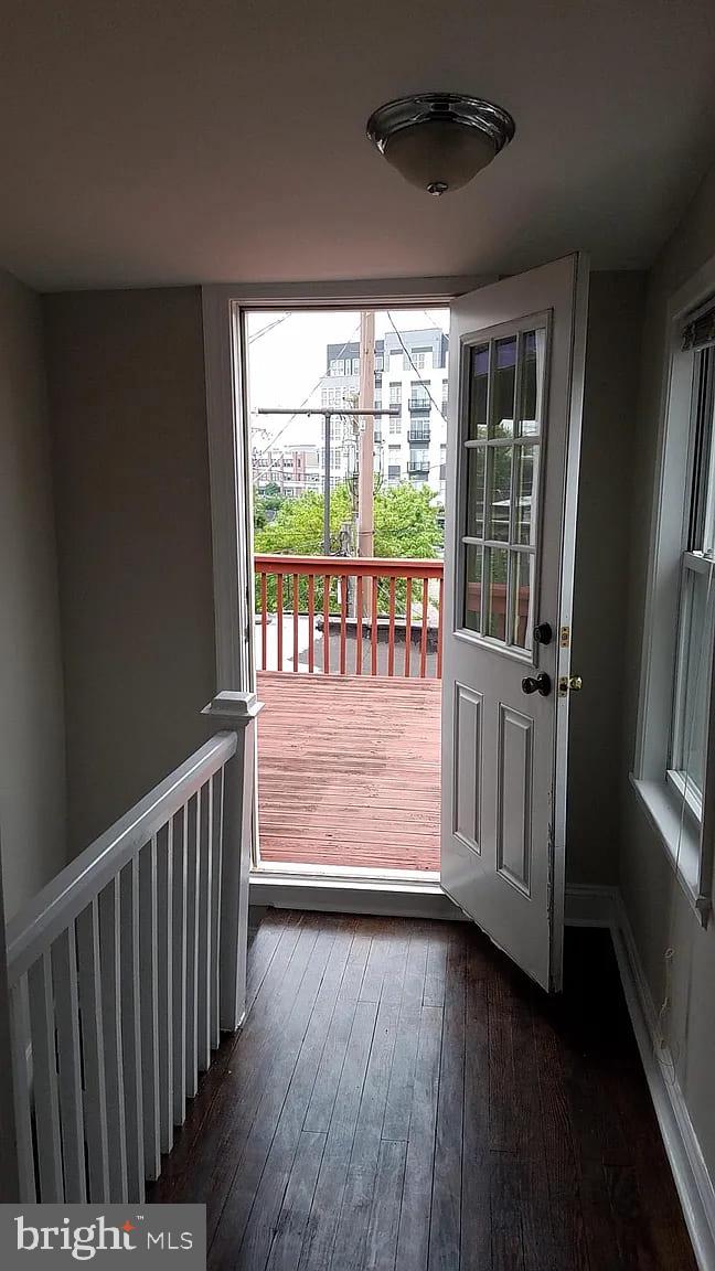 1128 South Hanover Street Baltimore, MD 21230 - Photo 25 of 26 a view of a porch with wooden floor and a floor to ceiling window