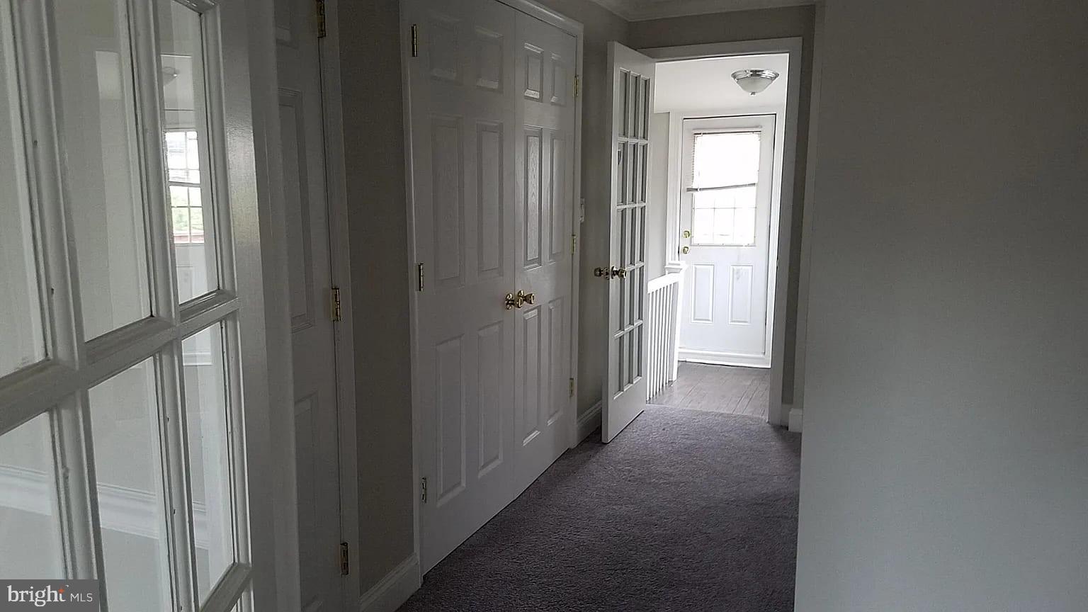 1128 South Hanover Street Baltimore, MD 21230 - Photo 5 of 26 a view of a hallway with a wooden door