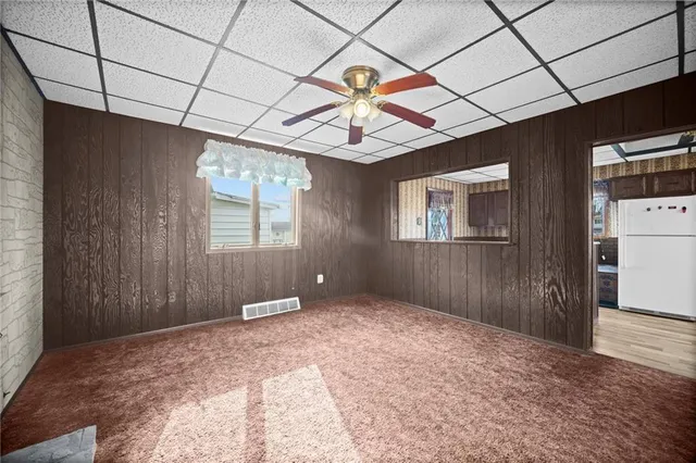 a view of a hallway with a chandelier