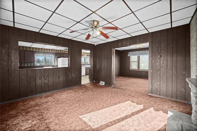 a kitchen with a stove cabinets and wooden floor