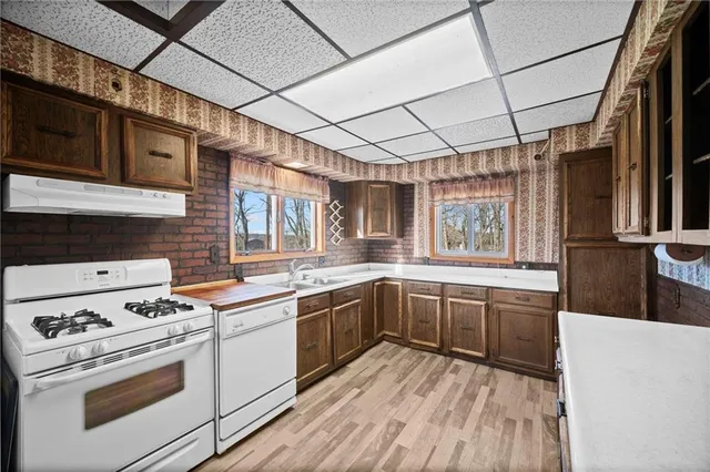 a kitchen that has a sink and a stove