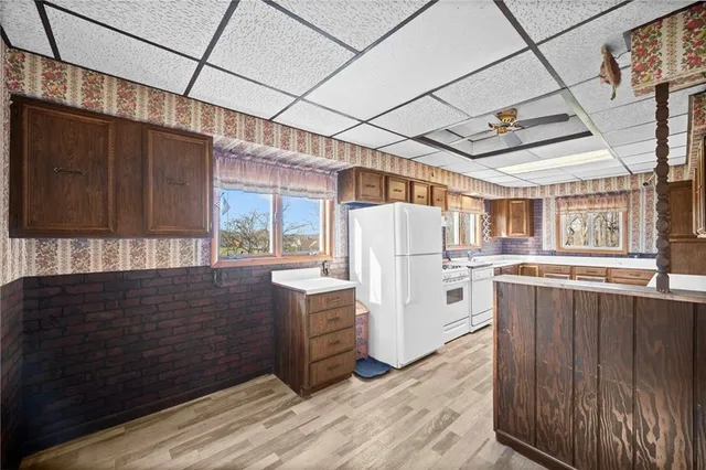 a bathroom with a tub shower and sink