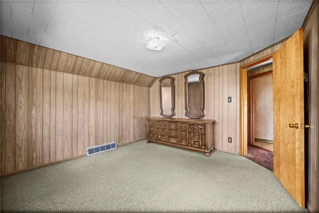 a view of walk in closet with wooden floor