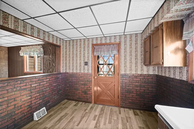 a view of entryway with wooden floor