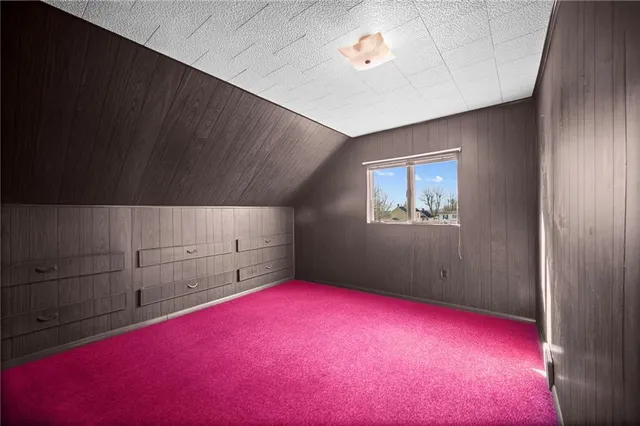 a bed room with a bed and a dresser