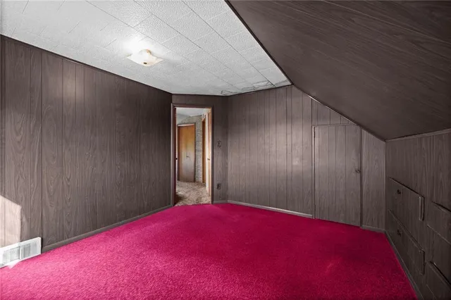 a spacious bathroom with a granite countertop sink and a mirror