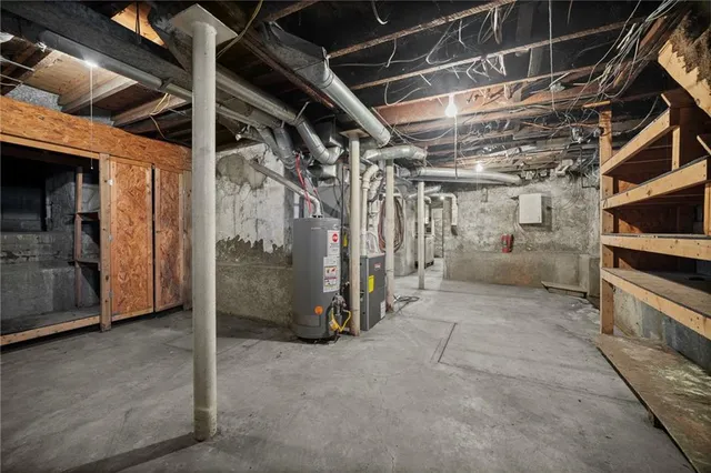 a bathroom with a tub a sink and a mirror