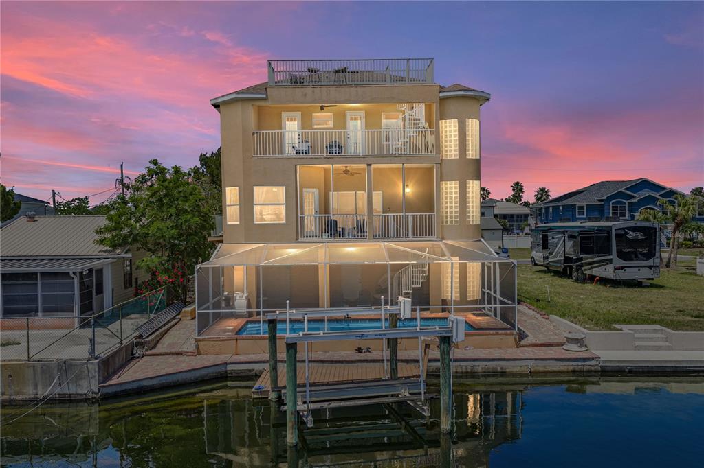4178 Des Prez Court Hernando Beach, FL 34607 - Photo 2 of 76 a front view of a house with a yard