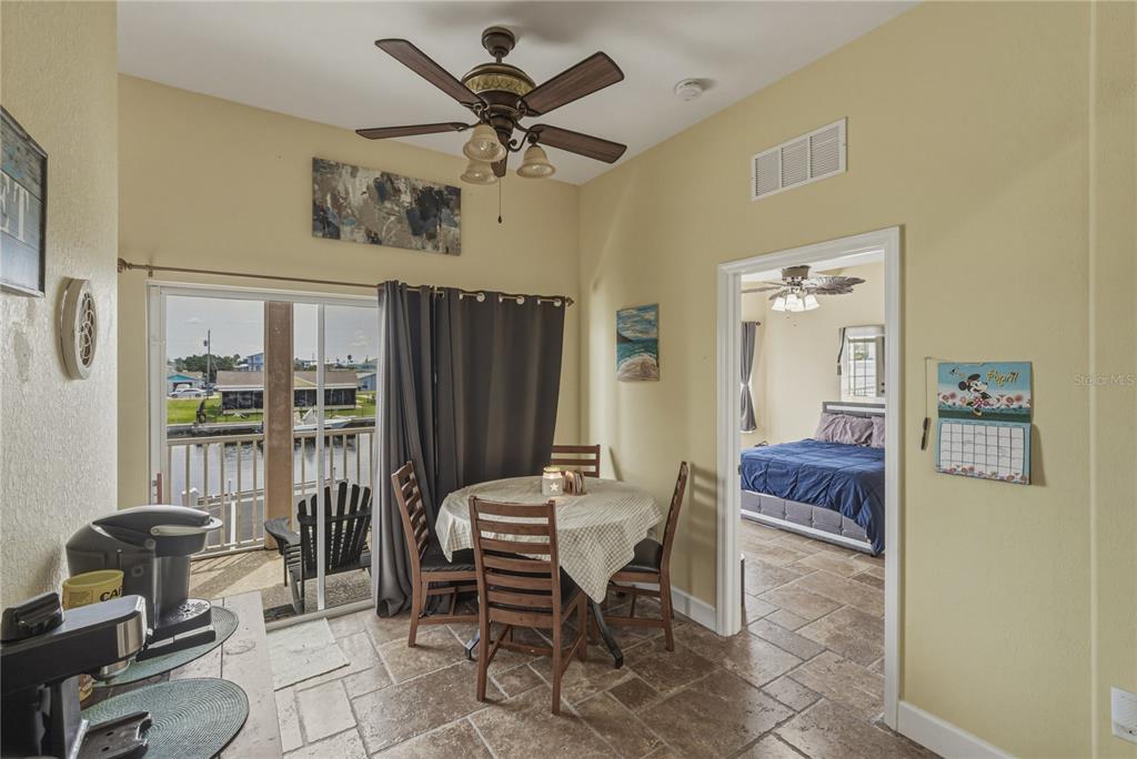 4178 Des Prez Court Hernando Beach, FL 34607 - Photo 22 of 76 a living room with furniture a flat screen tv and a window