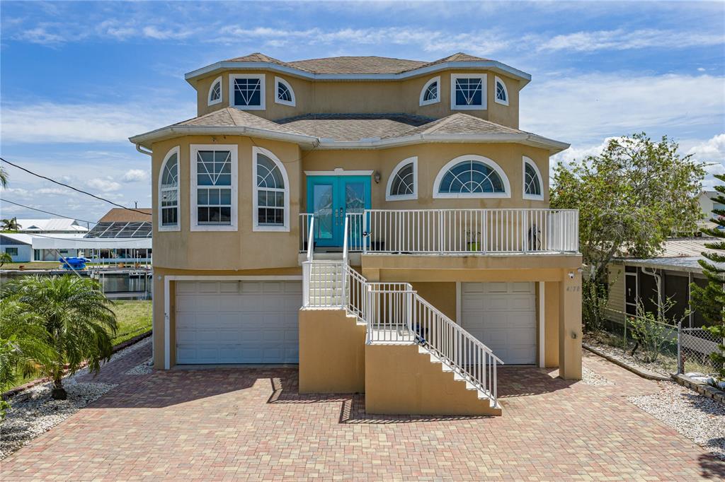 4178 Des Prez Court Hernando Beach, FL 34607 - Photo 3 of 76 a front view of a house with a yard