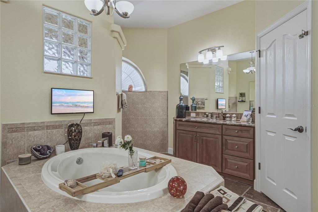 4178 Des Prez Court Hernando Beach, FL 34607 - Photo 33 of 76 a bathroom with a sink a toilet and a mirror