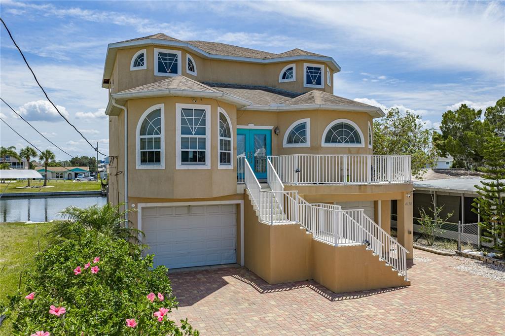 4178 Des Prez Court Hernando Beach, FL 34607 - Photo 4 of 76 a front view of a house with a yard