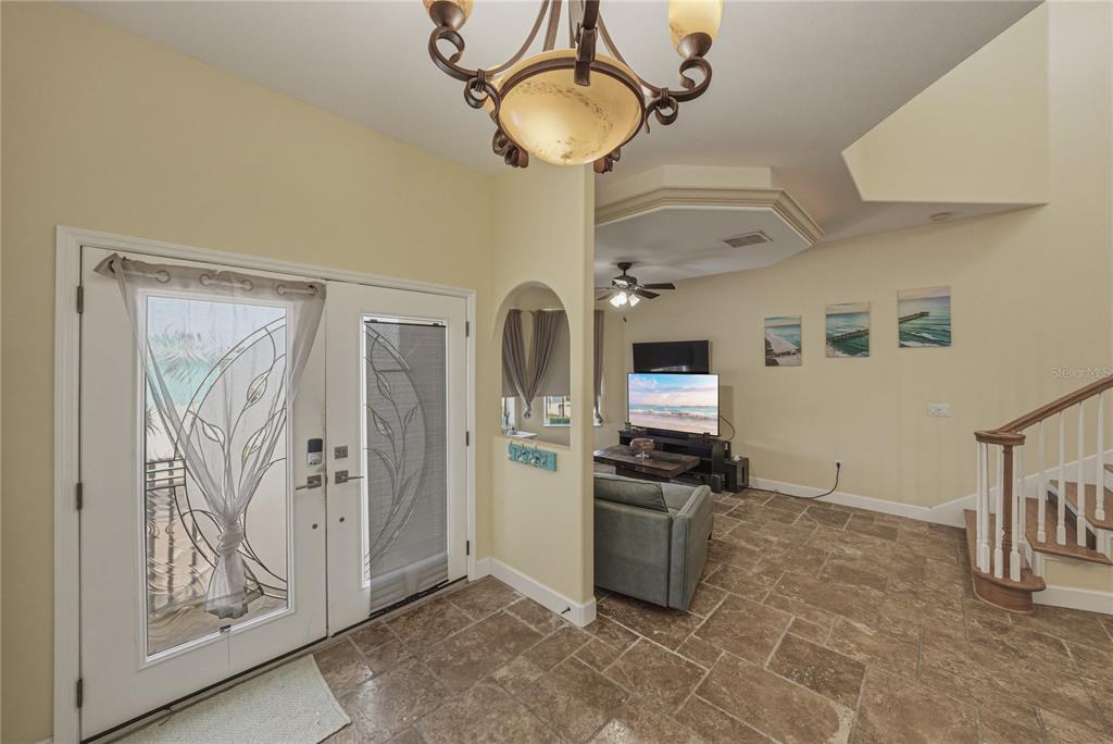 4178 Des Prez Court Hernando Beach, FL 34607 - Photo 6 of 76 a kitchen with stainless steel appliances granite countertop a refrigerator and a stove top oven