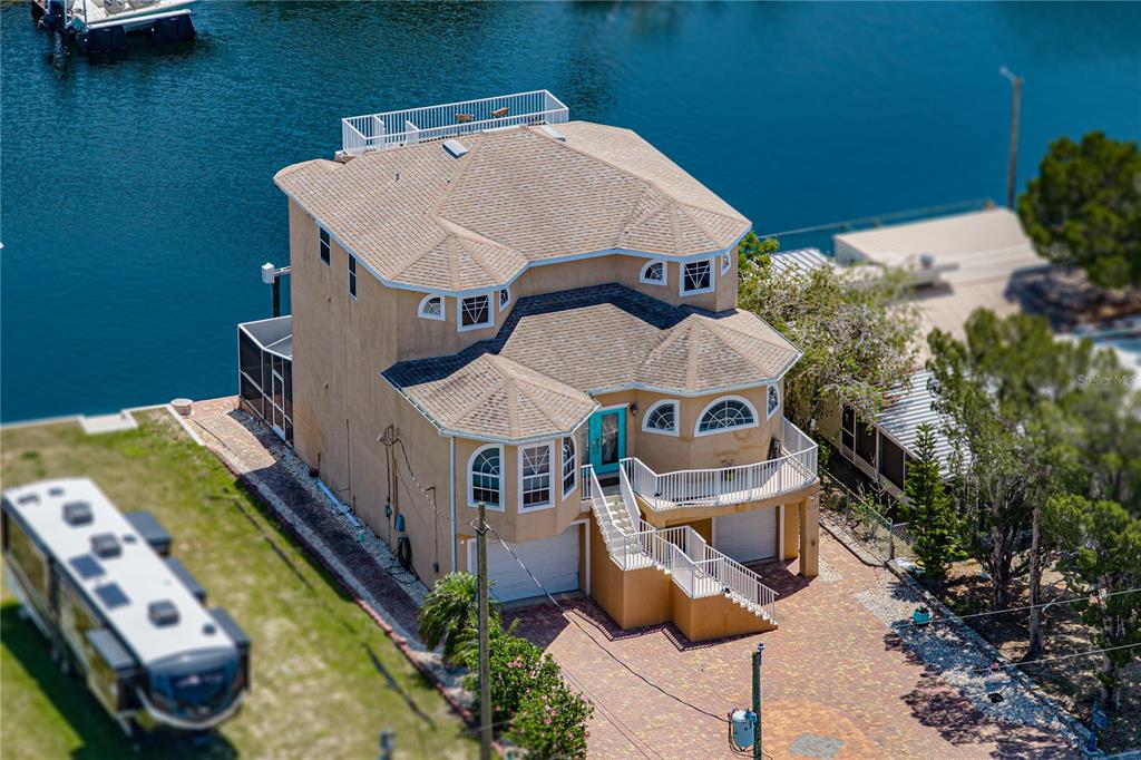 4178 Des Prez Court Hernando Beach, FL 34607 - Photo 62 of 76 an aerial view of a house with swimming pool and patio