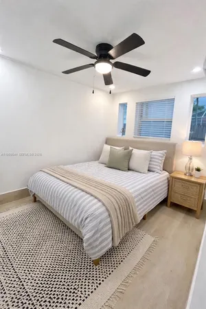 a bedroom with a bed and a walk in closet