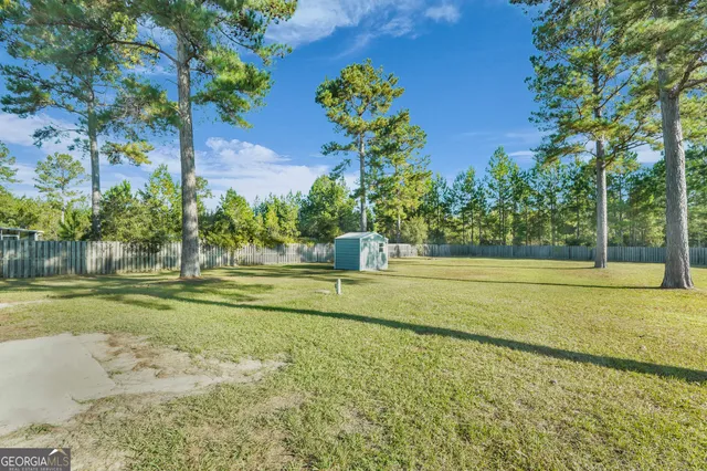 a view of a house with a big yard