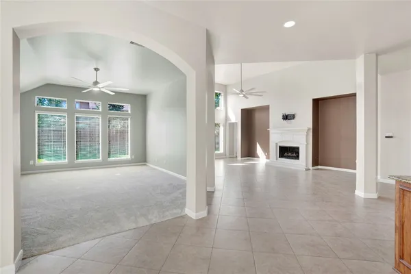 a view of an empty room with a fireplace