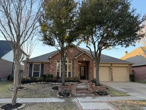 a front view of a house with sitting area