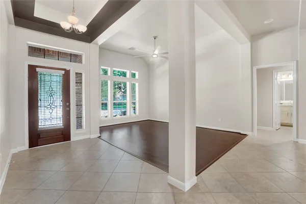 a view of an entryway with wooden floor and a large window
