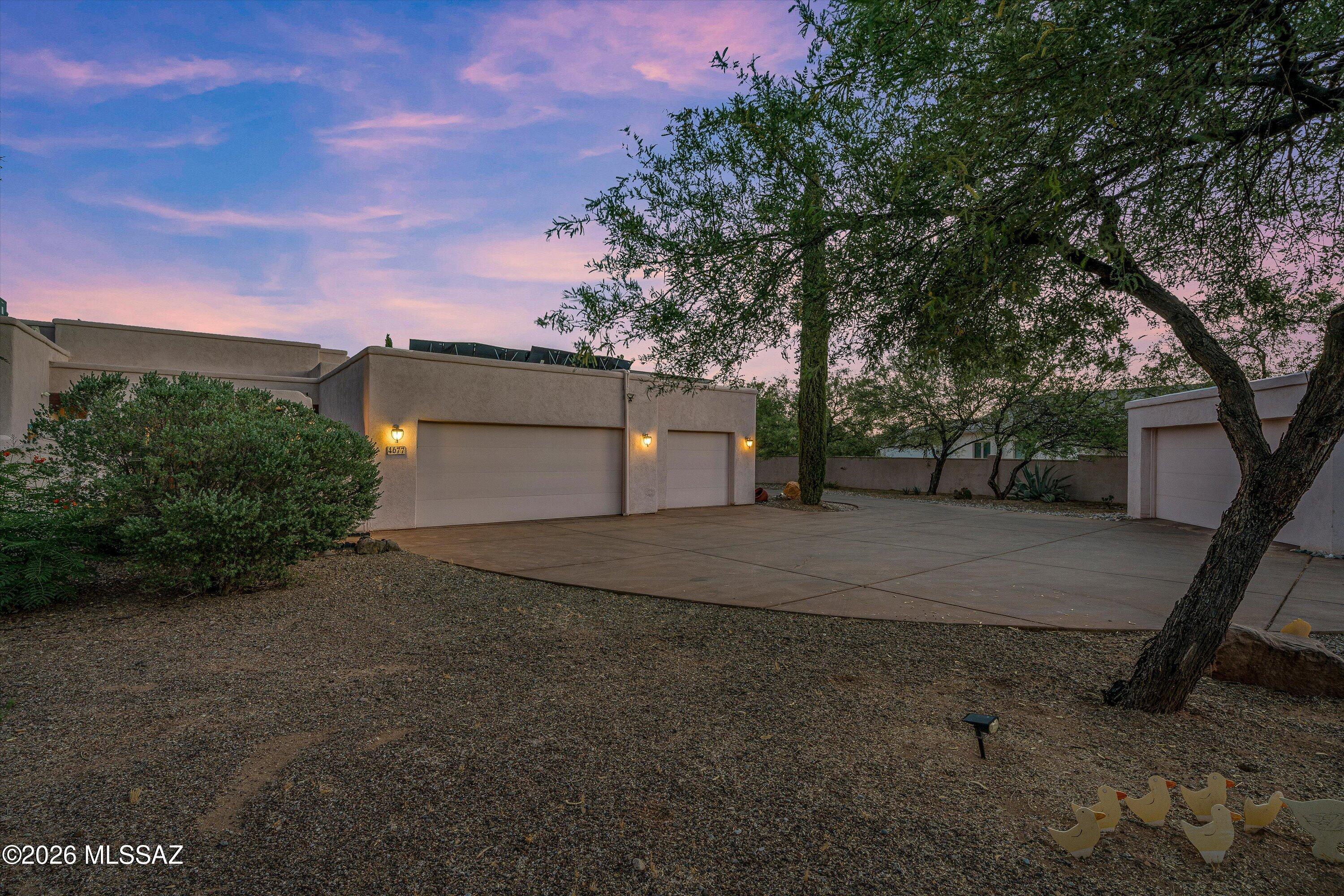 4677 East Rail N Road Tucson, AZ 85739 - Photo 38 of 48 3 car attached garage next to the entryway to courtyard and additional 2 car detached garage
