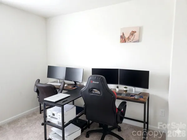 a view of a workspace with furniture