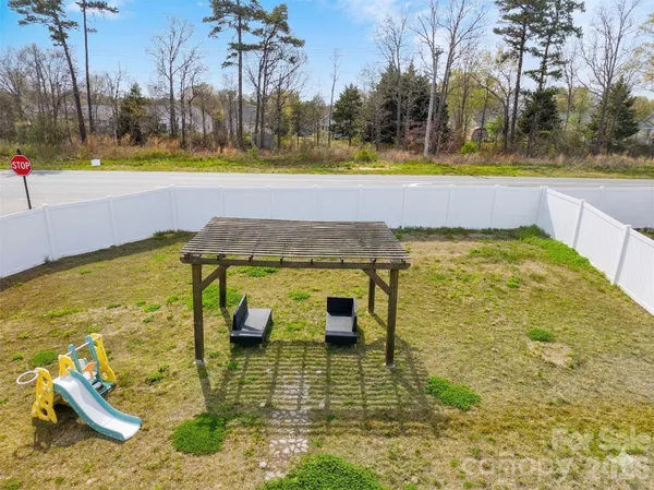 a view of a swimming pool with an outdoor space and seating area